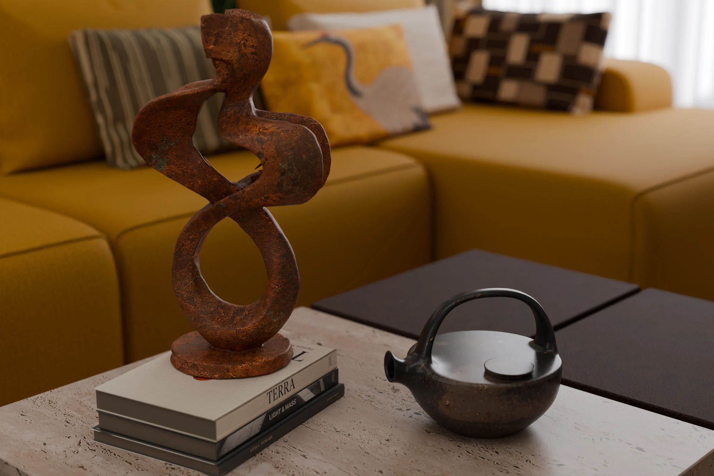 A copper sculpture on art books beside a stoneware teapot on travertine